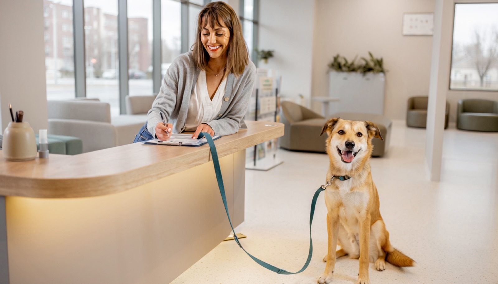 New adopter reviewing adoption paperwork with a rescue dog at home in Regina, Saskatchewan